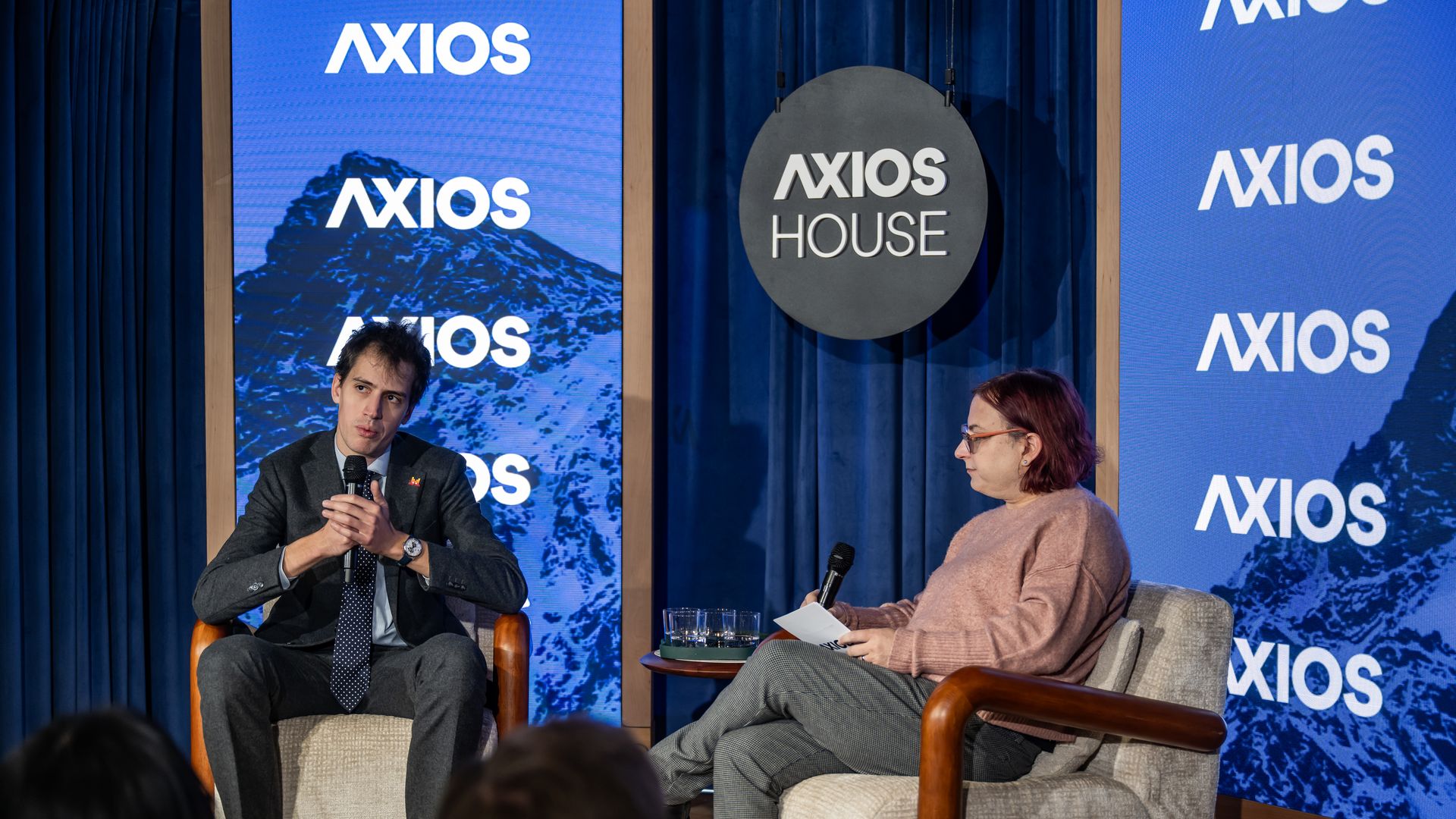 Arthur Mensch speaking with journalist Ina Fried at Axios House in Davos