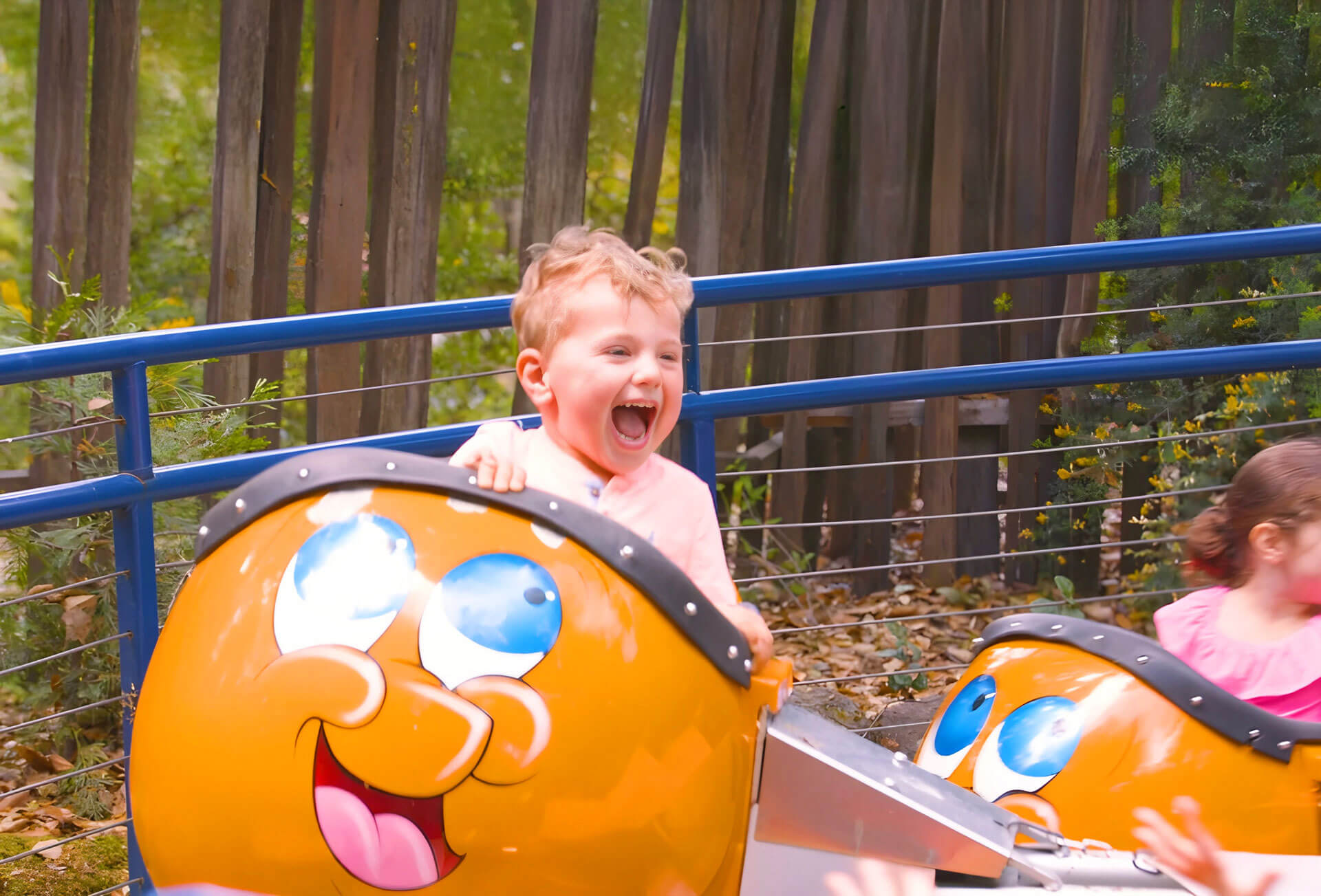 A child enjoying a ride at Gilroy Gardens, shown in the agency’s client portfolio