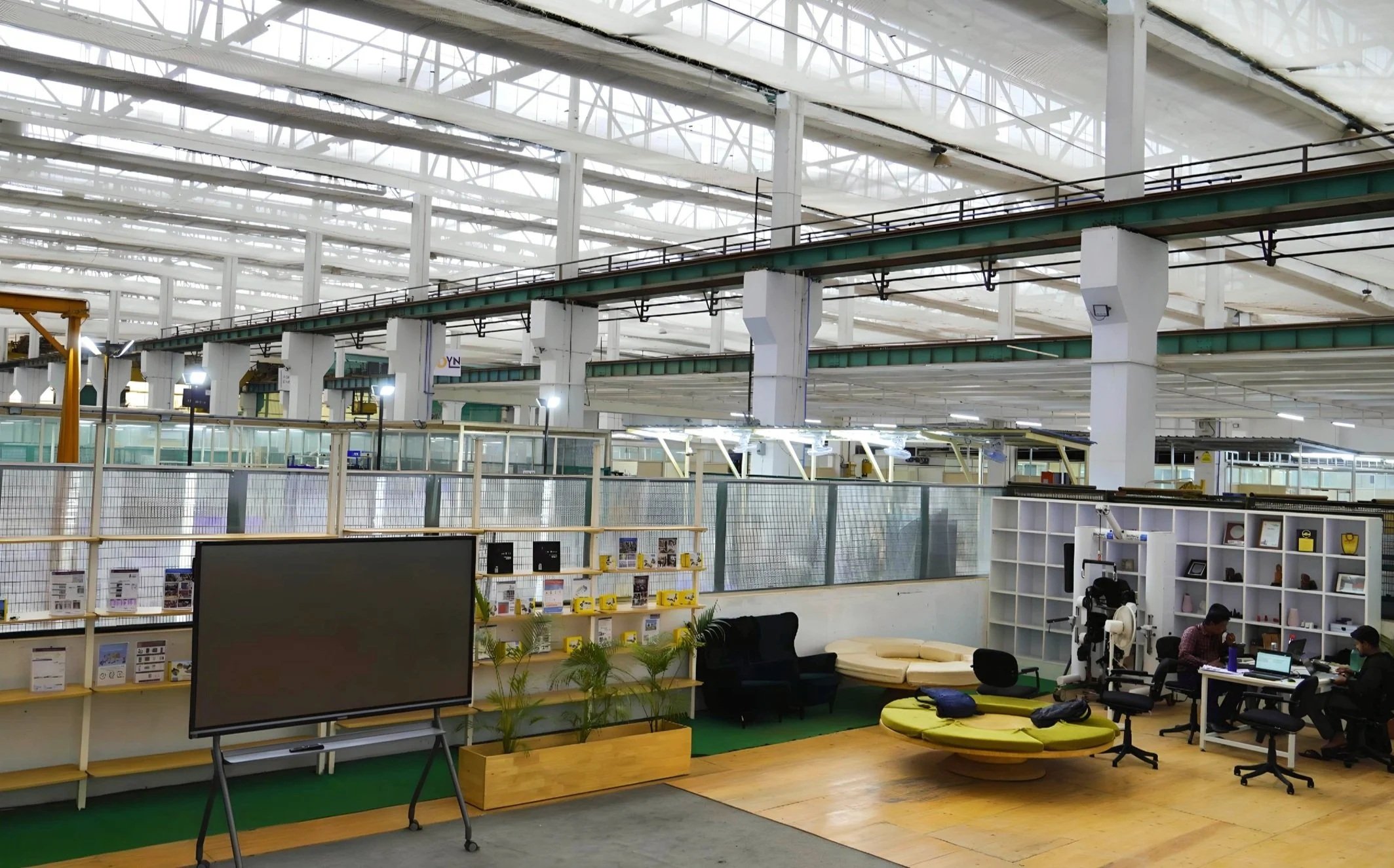 ARTPARK’s shared workspace and lounge beneath a large industrial roof