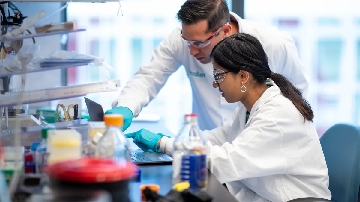 Ascidian researchers Robert Bell and Savita Matapurkar working at a laboratory bench