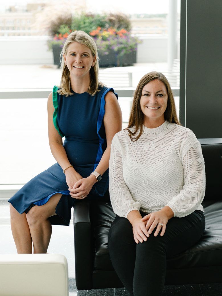 Asher Agency owners Megan Bennett and Kara Kelley seated together