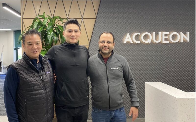 Ping Wu, Matt Matsui and Ashish Koul standing together in Acqueon’s office