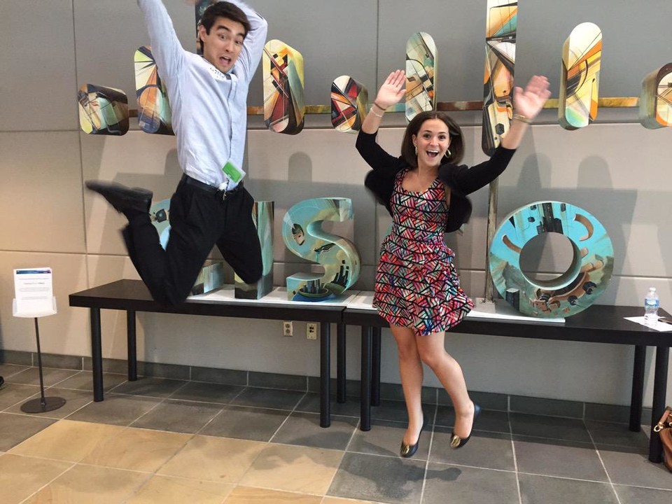 The internship photograph accompanying Ashley Pearlman’s 2015 essay, with two people jumping in front of Cisco lettering.
