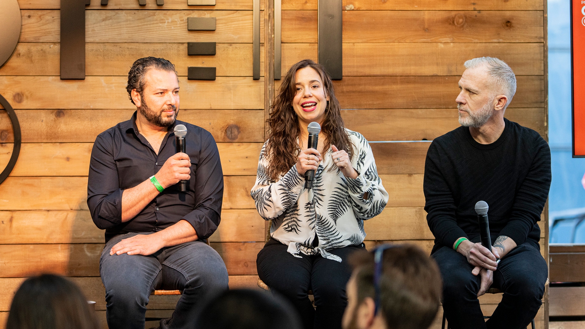 Ashraf Alkarmi, at left, speaking on a panel with Cristina Apple Georgoulakis and Rob Seaman at the Fast Company Grill during SXSW 2023