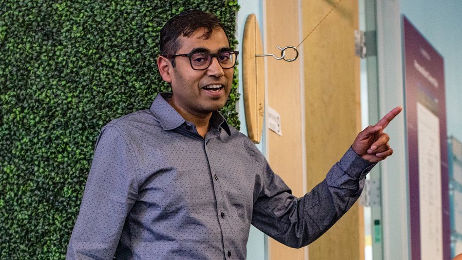 Ashutosh Garg gesturing while speaking in an Eightfold office