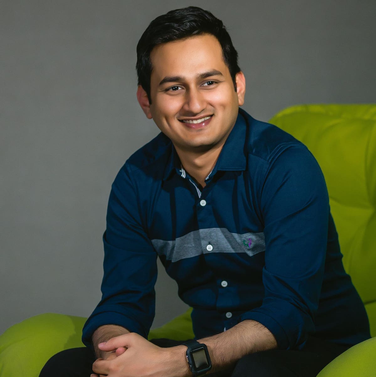 Ashwin Ramesh seated for a Forbes portrait
