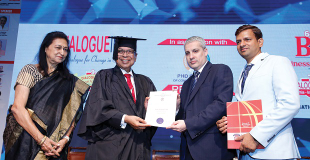 Asoke K. Laha in academic regalia receiving an honorary doctorate at a ceremony