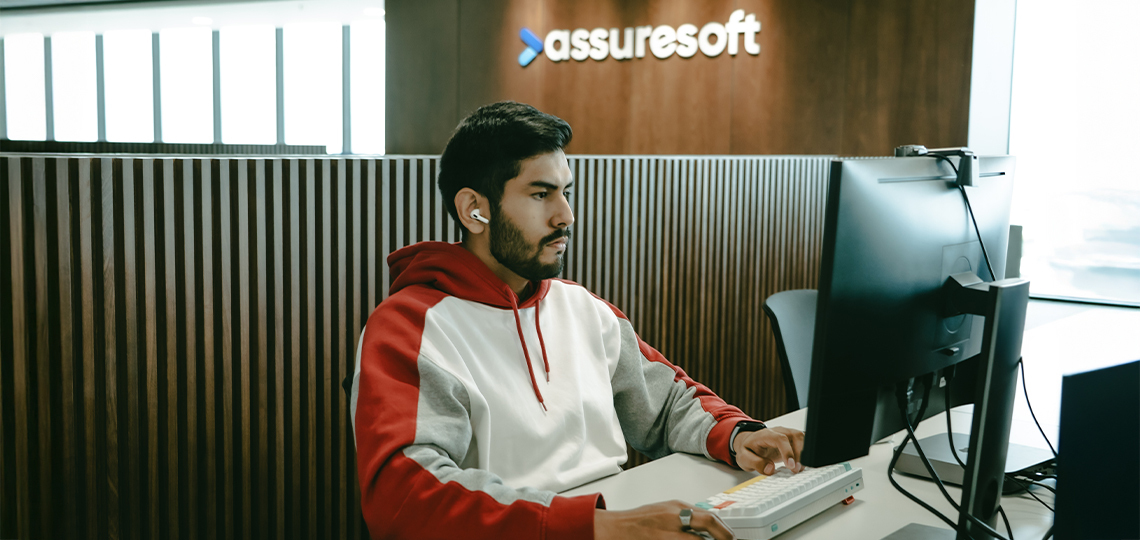 An engineer working at a desk in AssureSoft’s Santa Cruz office