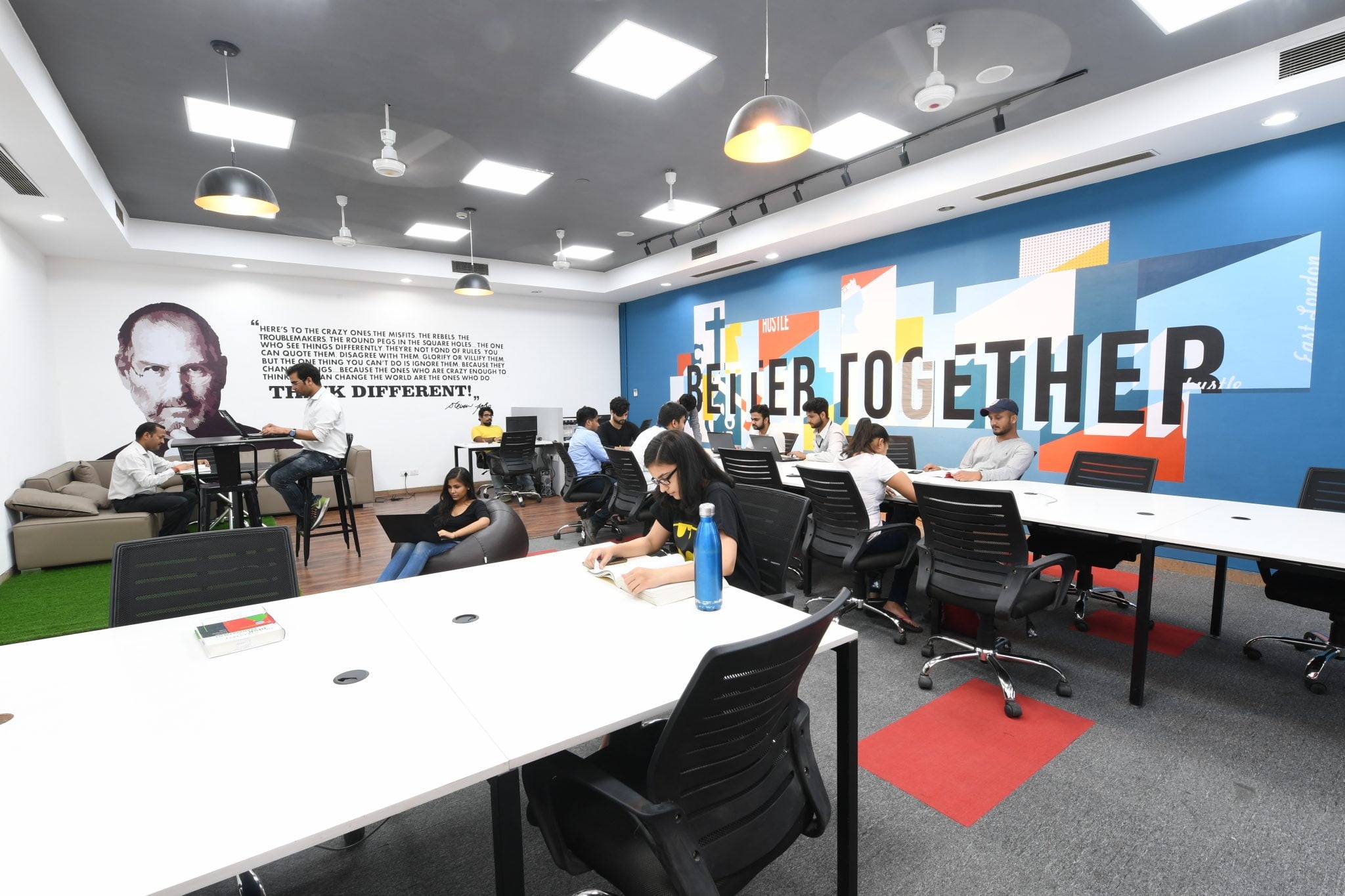 Shared desks and founders working in a workspace advertised by AIC-BIMTECH