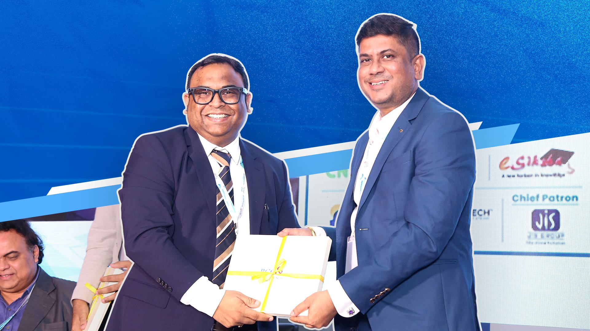 Atanu Sarkar, right, receiving a presentation at the Bengal Chamber Tech-E Summit in Bengaluru