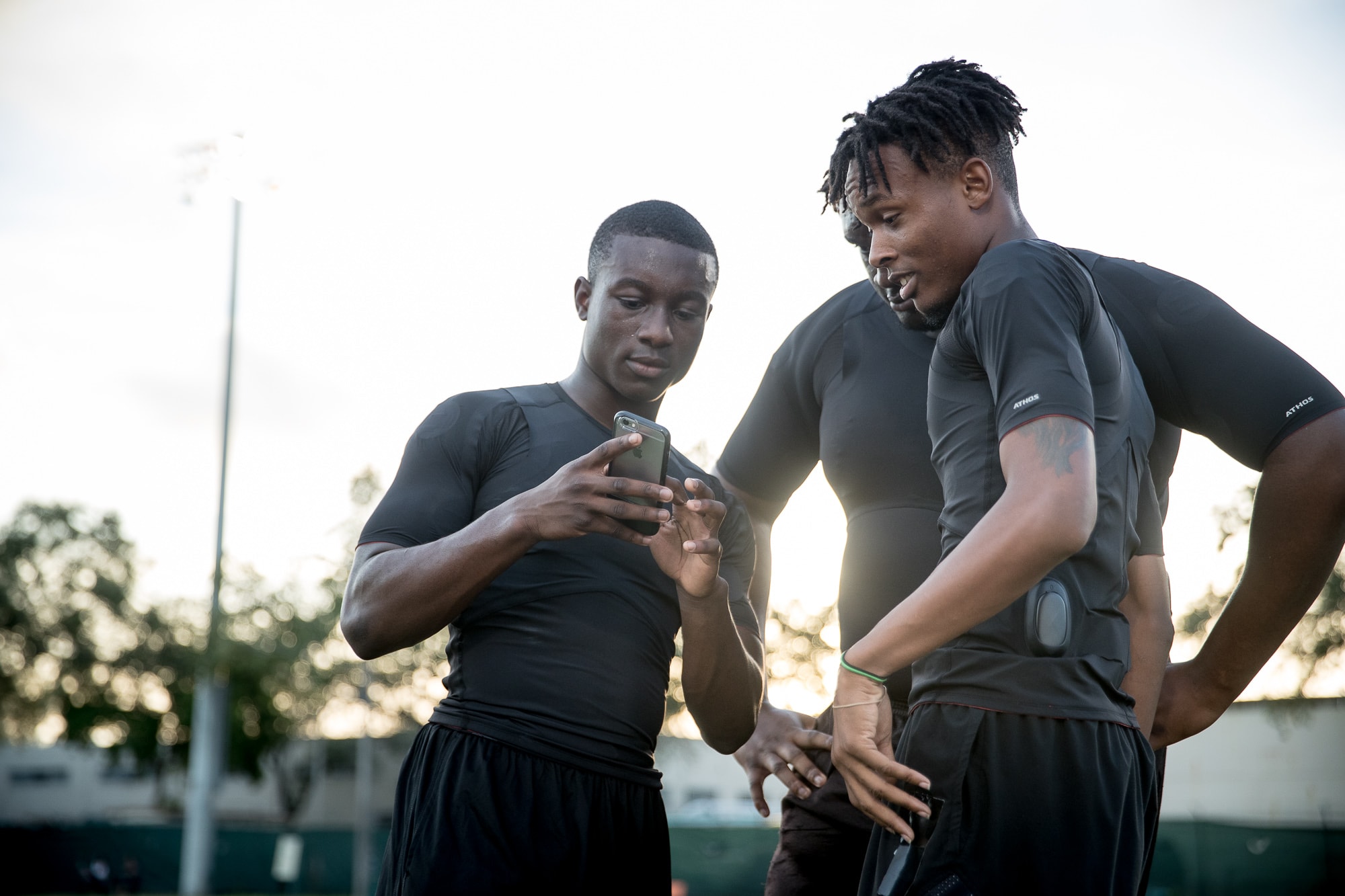 Athlete training in black Athos sensor apparel