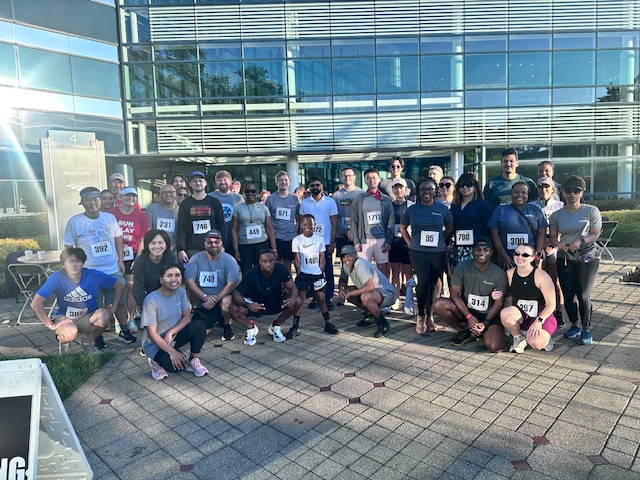 Atlanticus colleagues gathered outdoors at Lauren’s Run in 2025