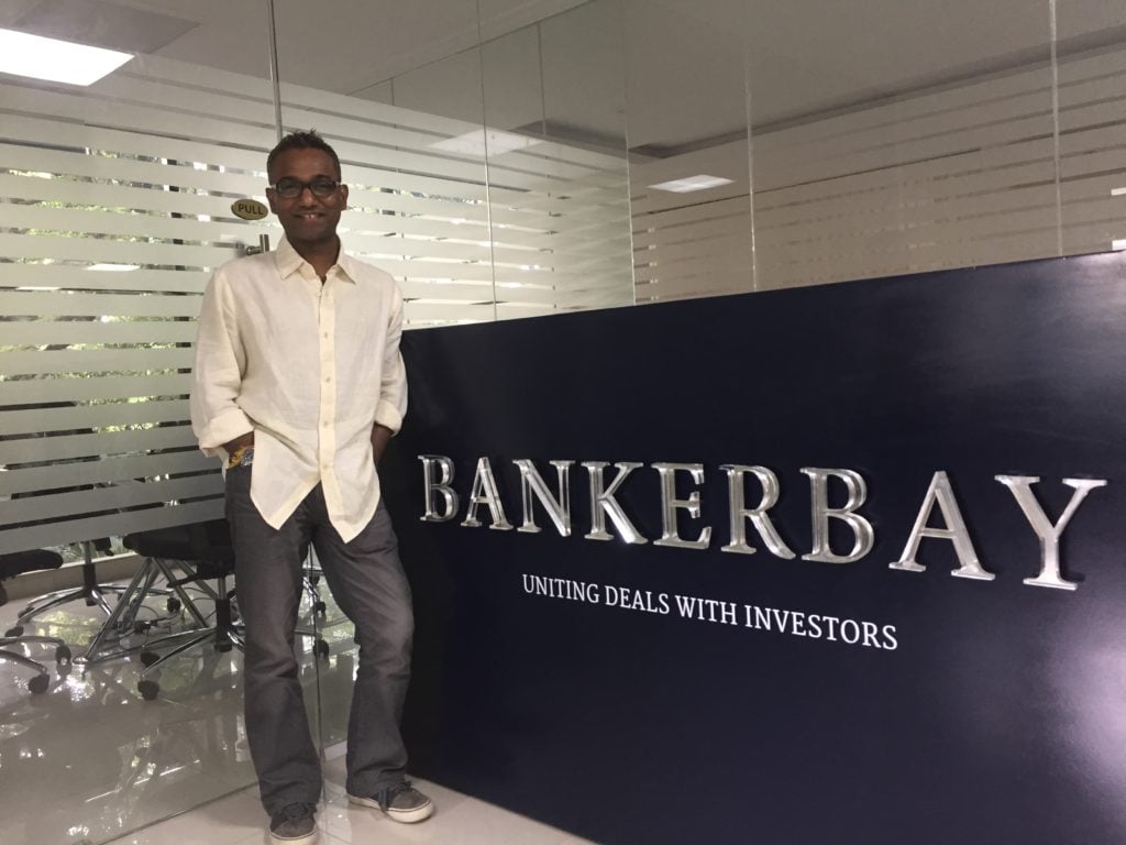 Romesh Jayawickrama standing in a BankerBay office