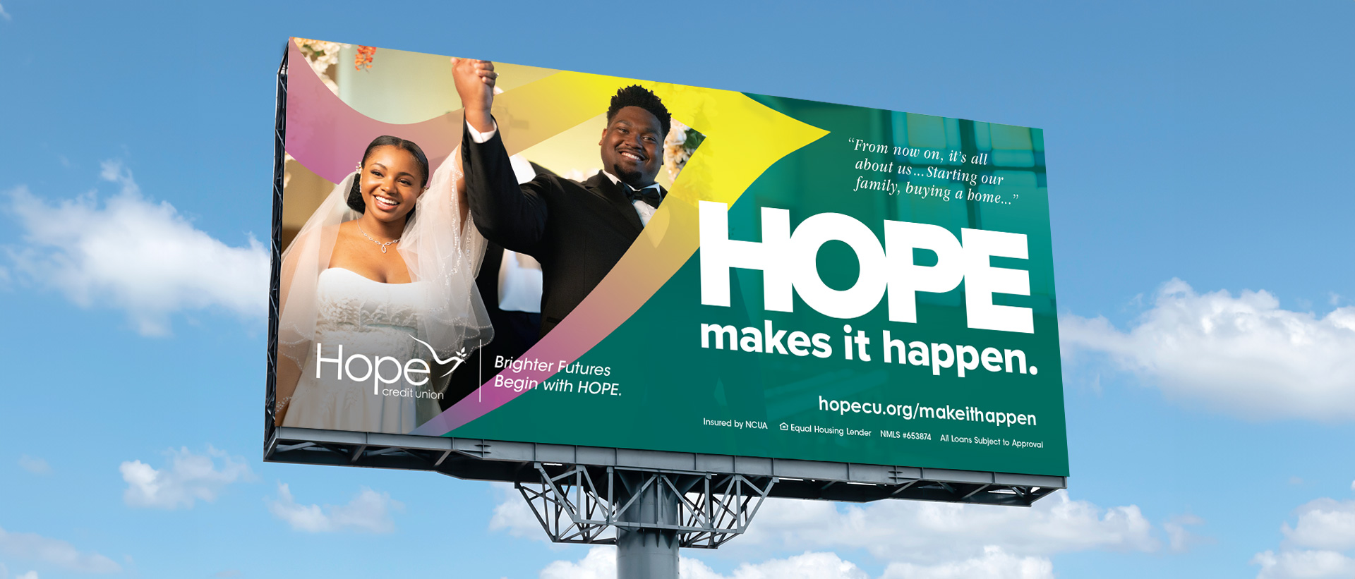A HOPE Credit Union billboard featuring newlyweds and the line HOPE makes it happen