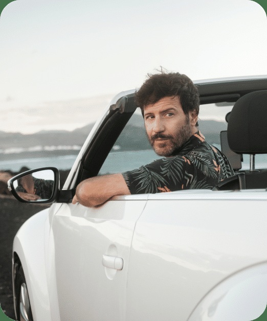 AUTOPAY marketing photograph of a driver leaning out of a white convertible