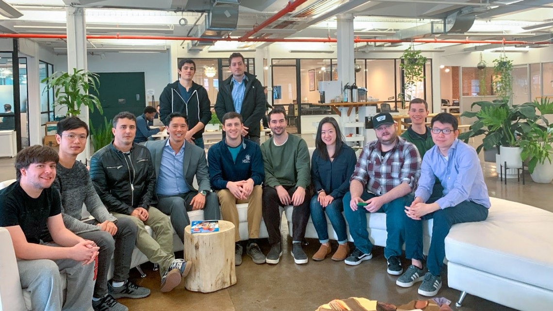 Early Ava Labs team gathered in an office, including co-founder Emin Gün Sirer
