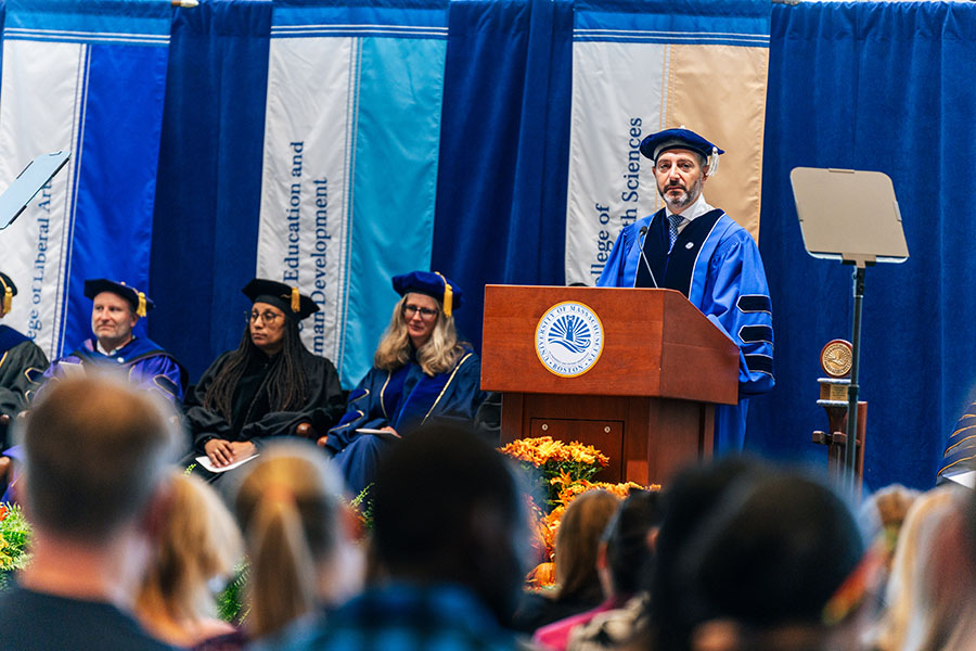 Avak Kahvejian speaking from the lectern at UMass Boston's 2024 convocation