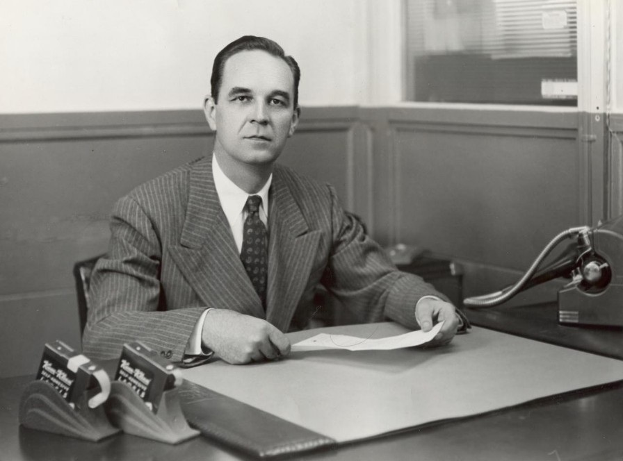 Stan Avery seated at a desk in 1935.