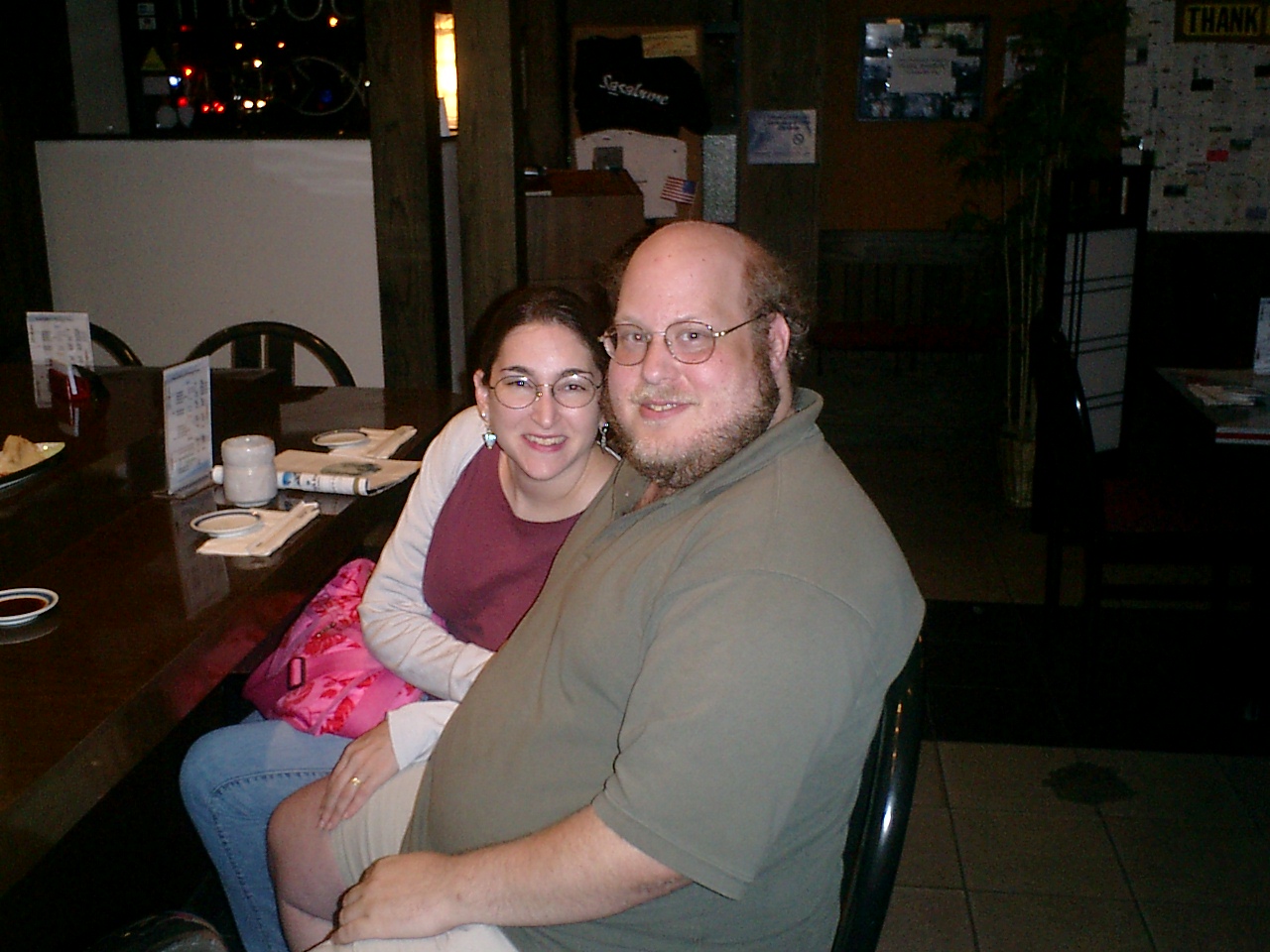 Avi Freedman, at right, seated with a companion at a restaurant in a candid photograph from his personal website