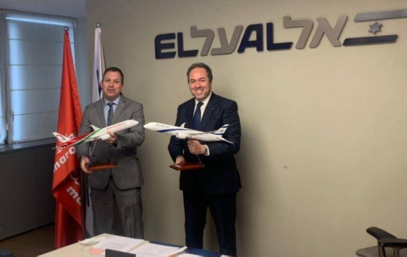 Hamid Addou, left, and Avigal Soreq, right, holding model aircraft at the Royal Air Maroc and El Al codeshare signing in Tel Aviv