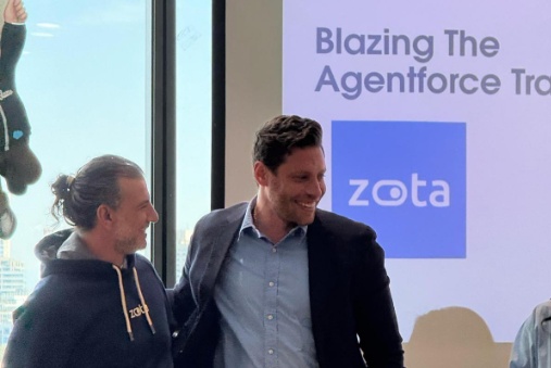 Avner Ziv, left, in a Zota hoodie, standing with Salesforce account executive Yaniv Lakunishok.