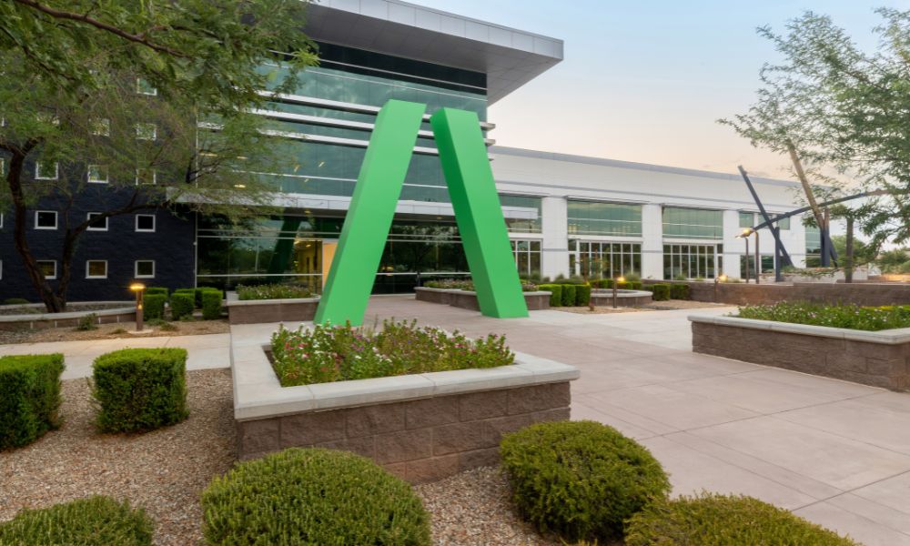 Avnet building with a large green A sculpture among landscaped gardens