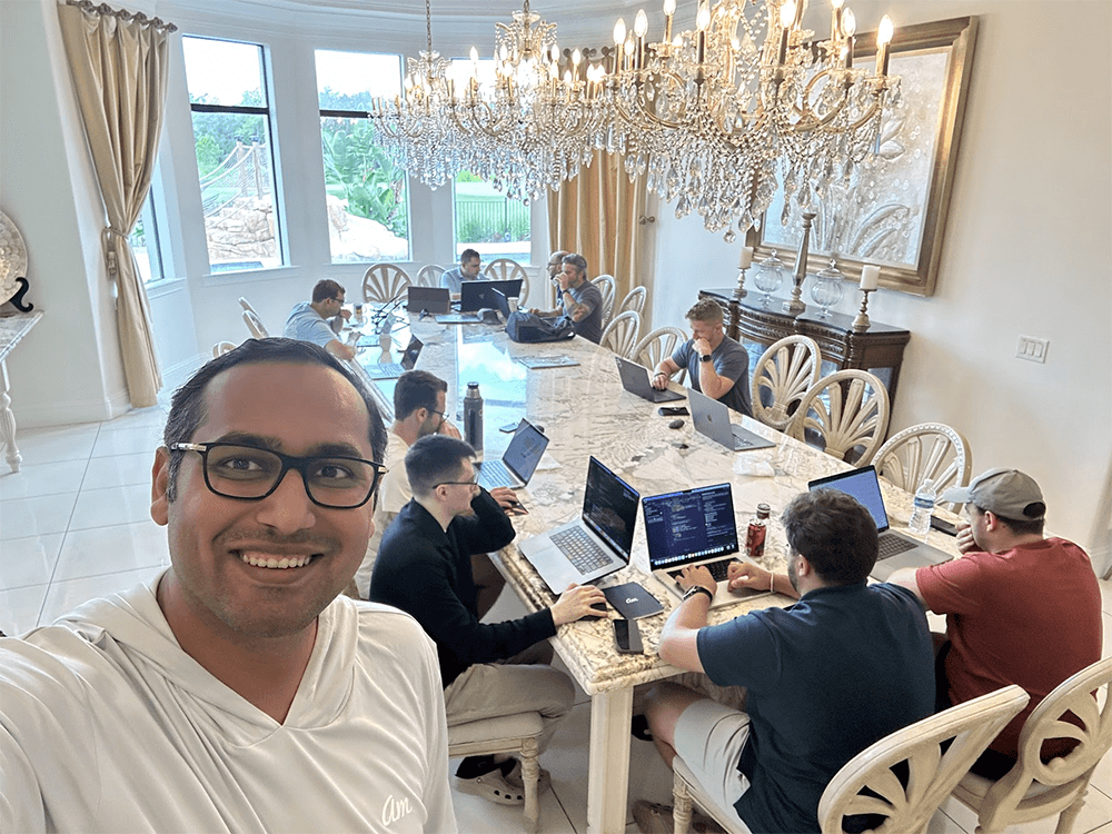 Awesome Motive colleagues working together at an AI hackathon