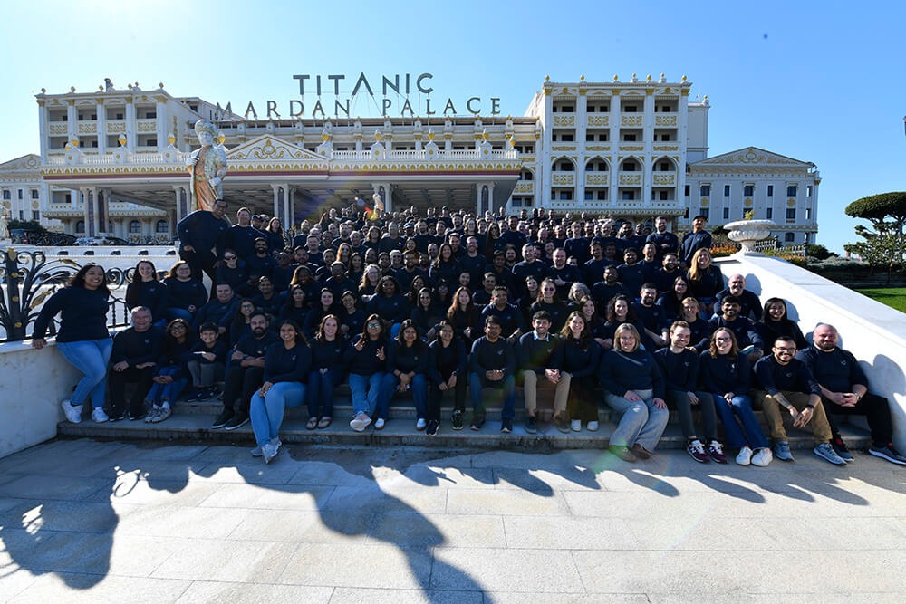Awesome Motive team gathered on the steps outside the Mardan Palace at its Antalya retreat