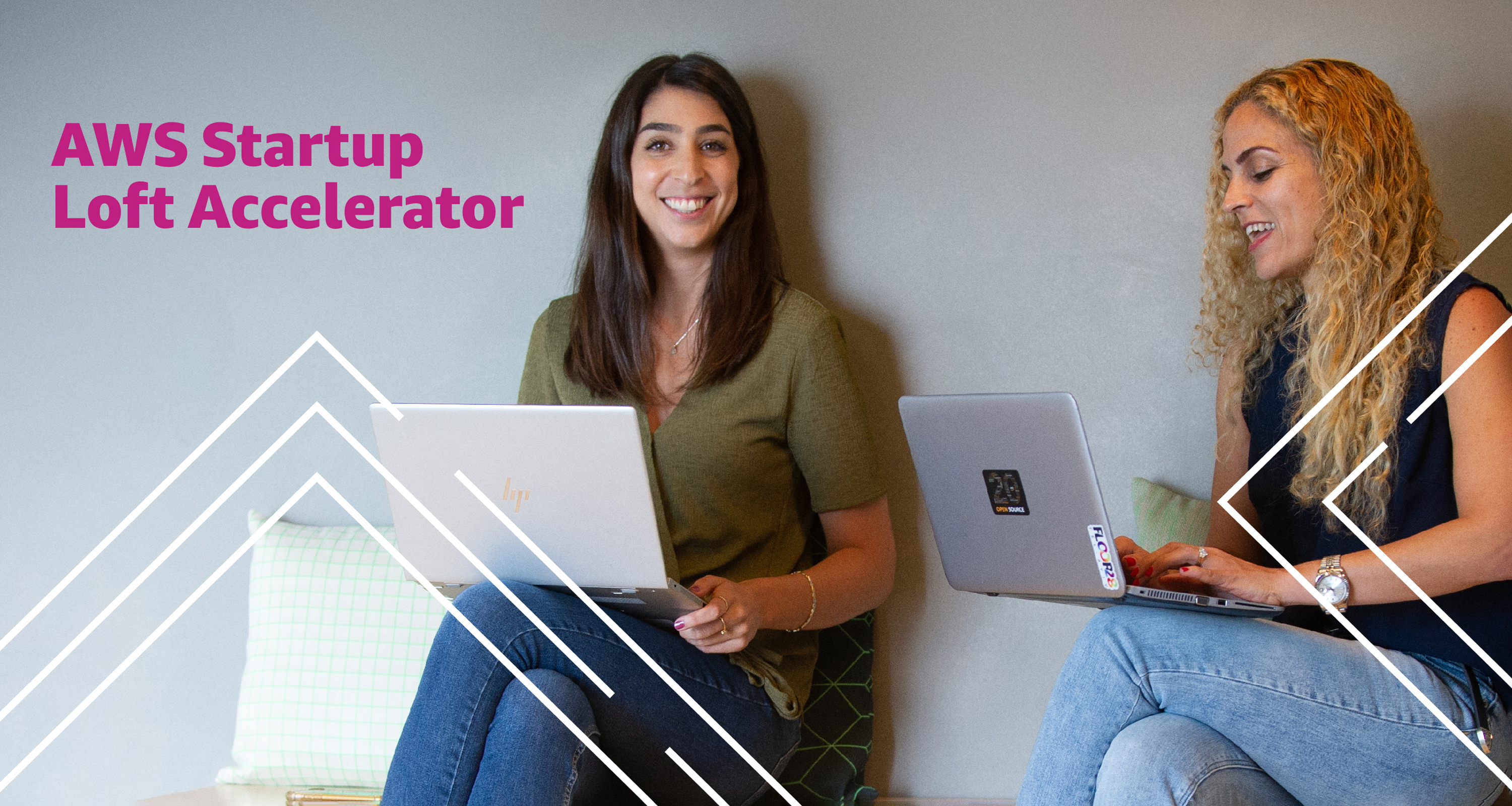 AWS Startup Loft Accelerator launch publicity image showing two women with laptops