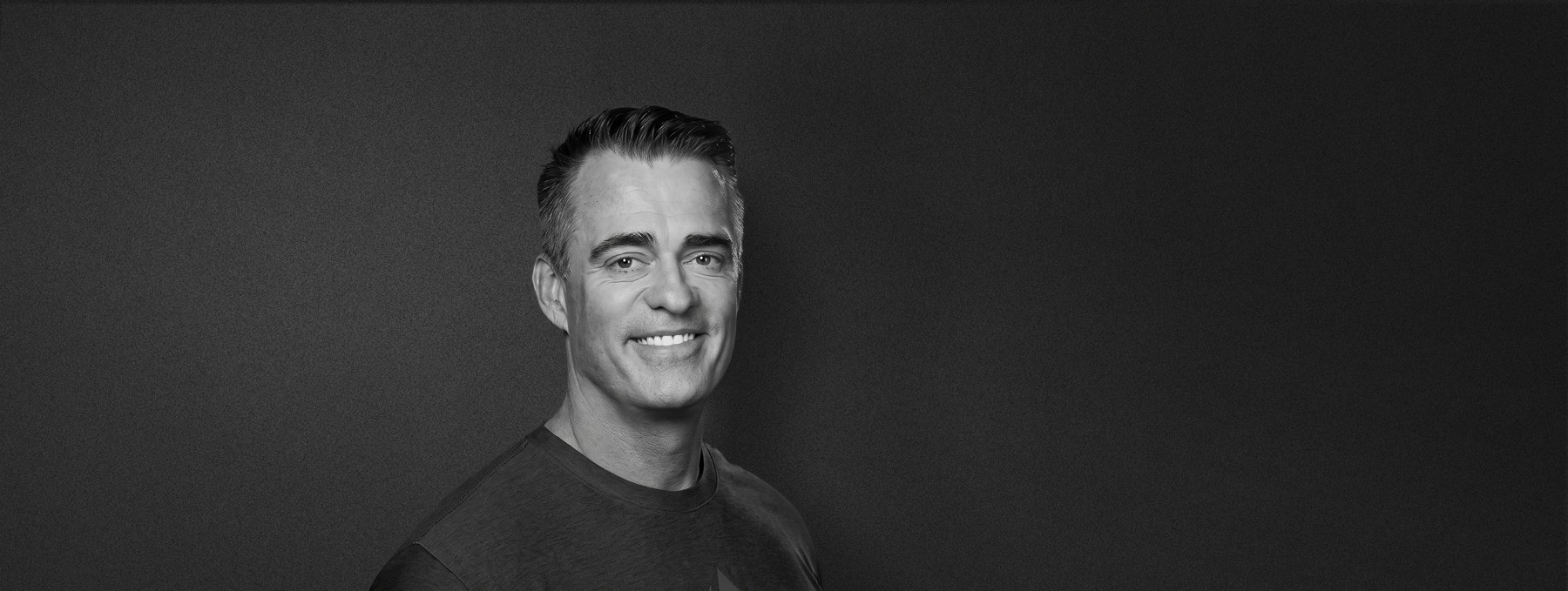 Axon co-founder and CEO Rick Smith in a black-and-white portrait