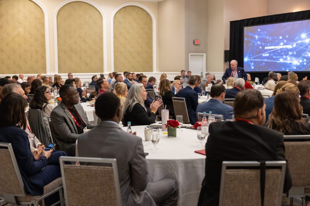 Care-at-home industry participants seated at tables during the AGILE 2026 leadership forum