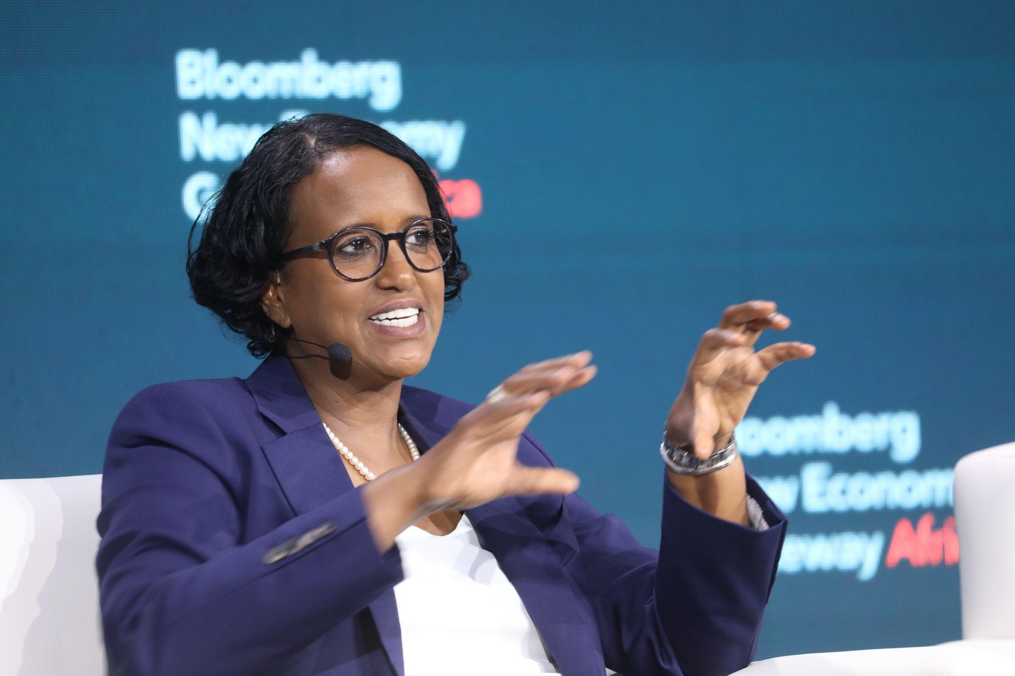 Ayaan Adam speaking and gesturing onstage at Bloomberg New Economy Gateway Africa in Marrakech