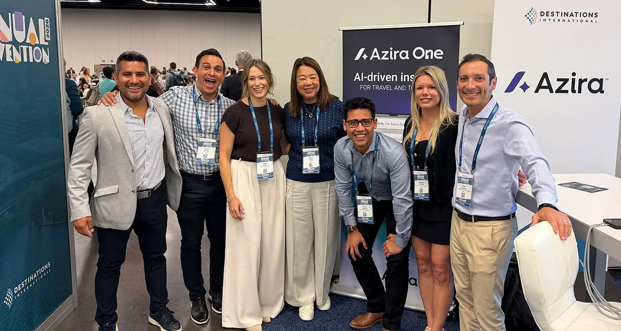 Azira colleagues gathered at a Destinations International convention booth