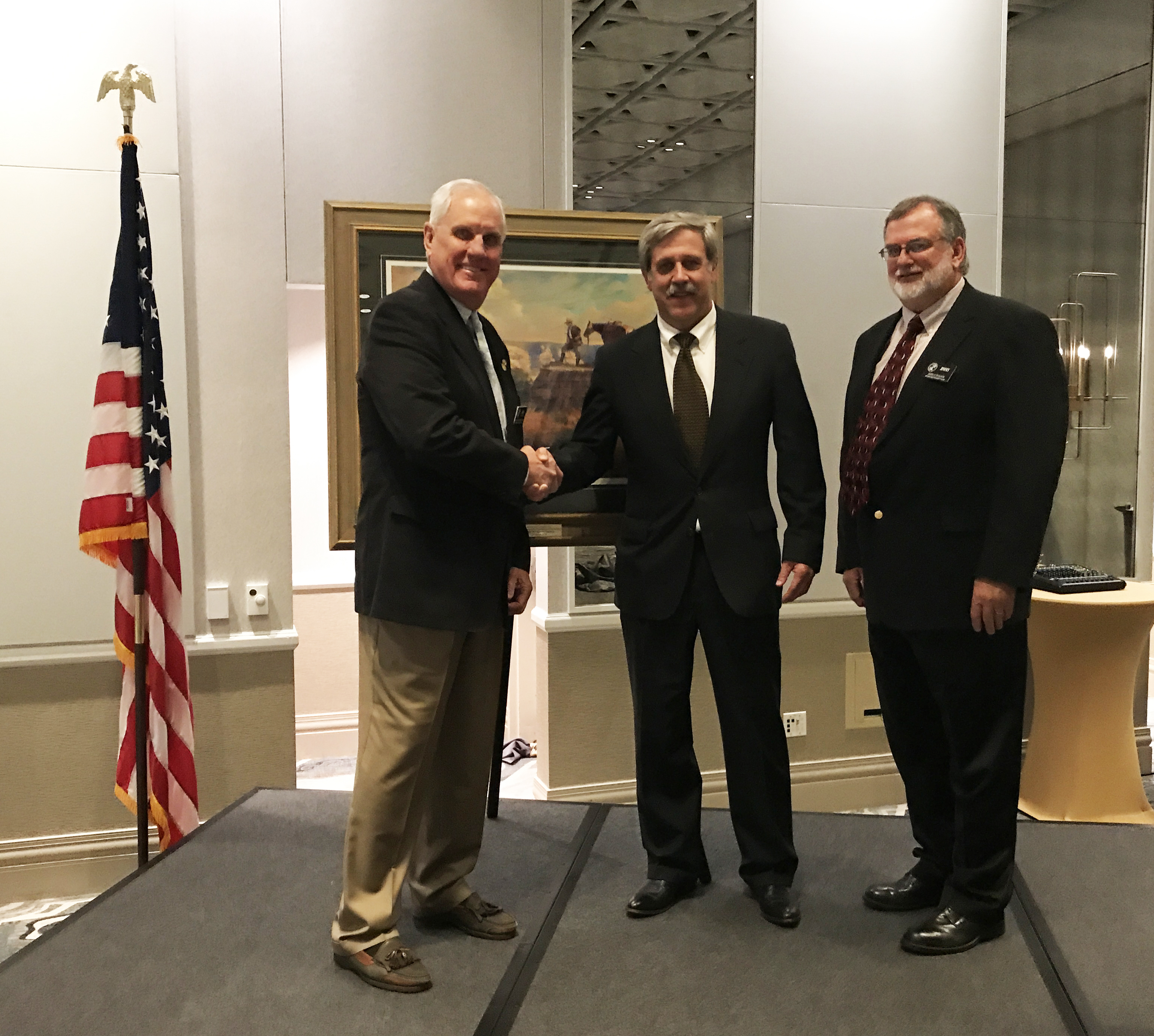 Ben Hollingsworth on the left presenting an award to Steve Williams, with Jimmy Bullock on the right