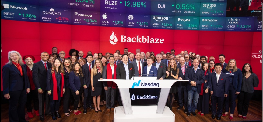 Backblaze employees celebrating at the Nasdaq podium