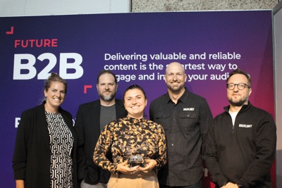 Backlight team members posing together at an industry event