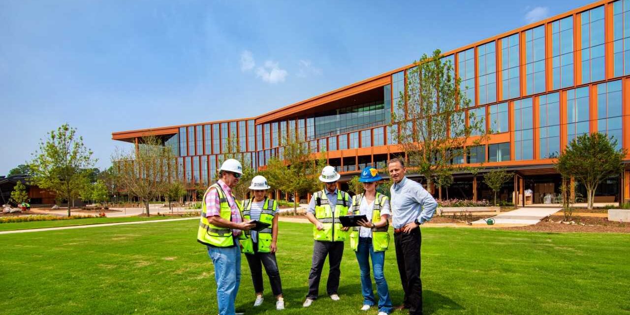 Bandwidth leaders in safety vests outside the company's new Raleigh headquarters