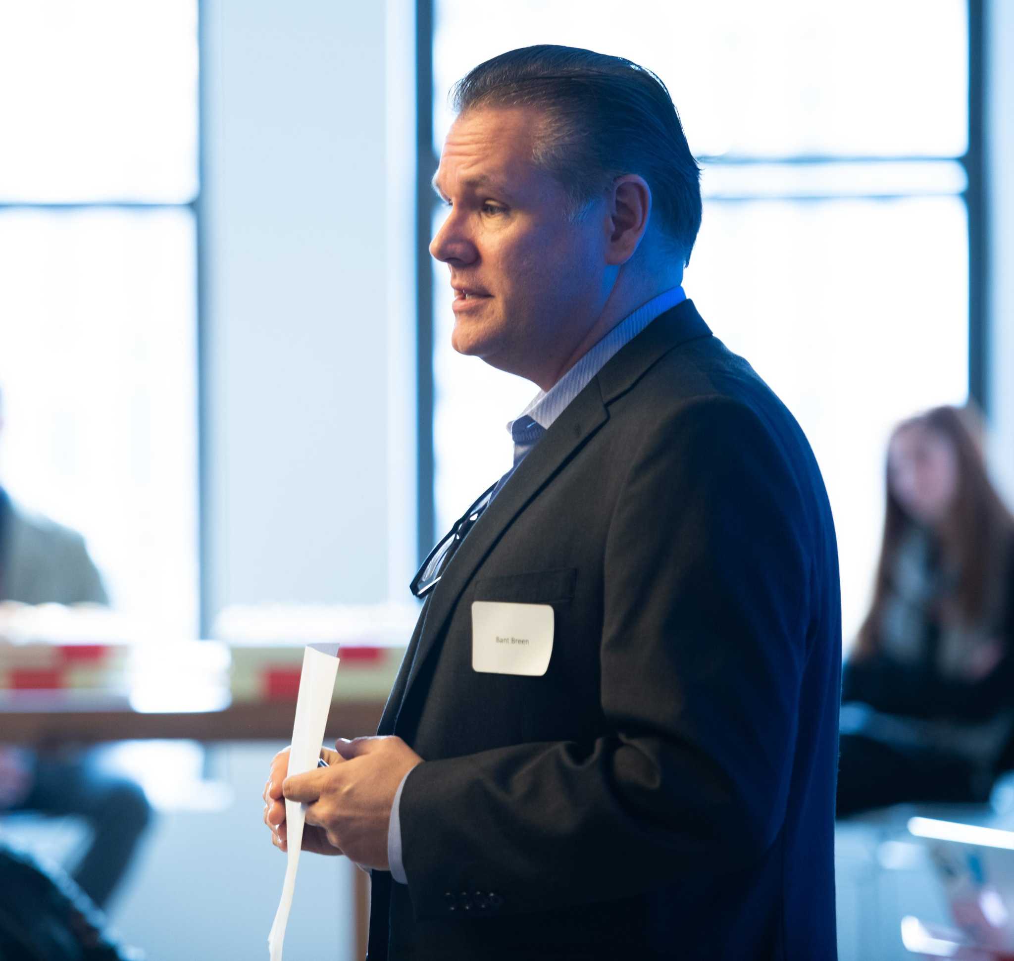 Bant Breen speaking to colleagues at a corporate gathering