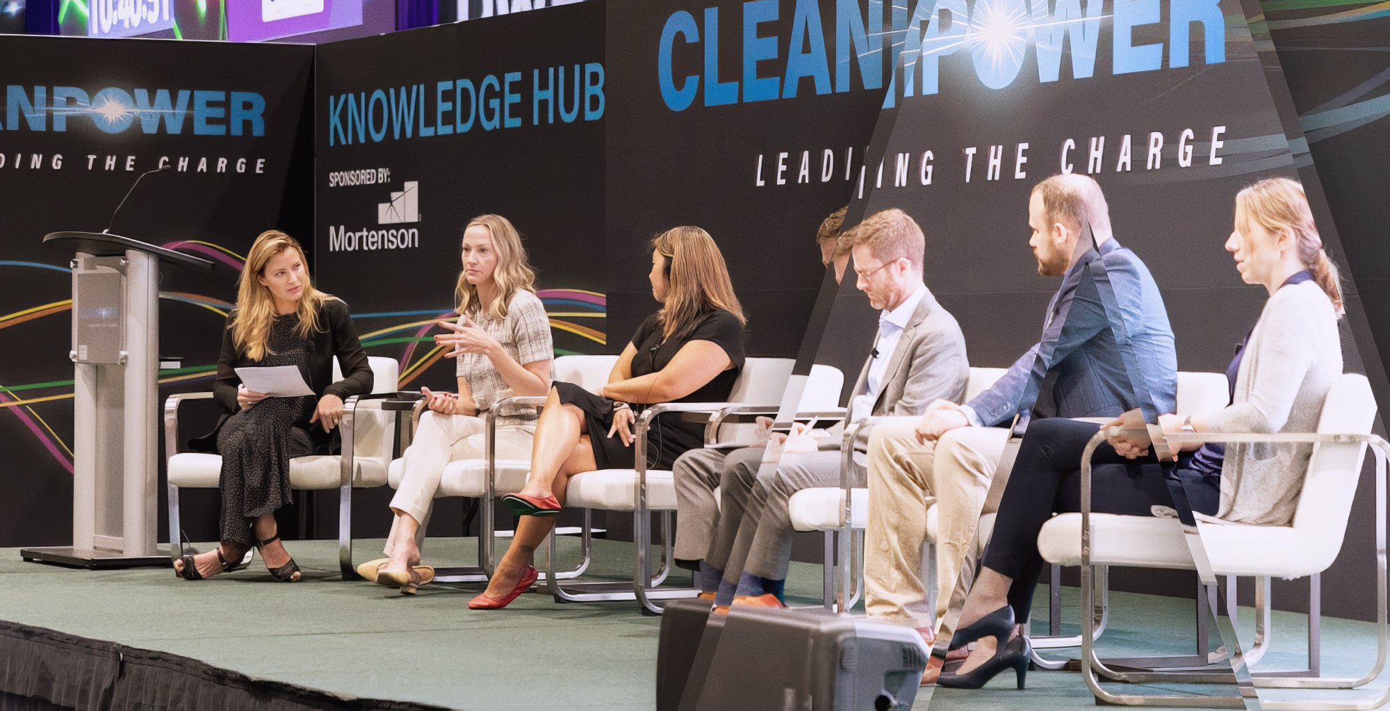 Clean-energy industry panel in conversation on a conference stage