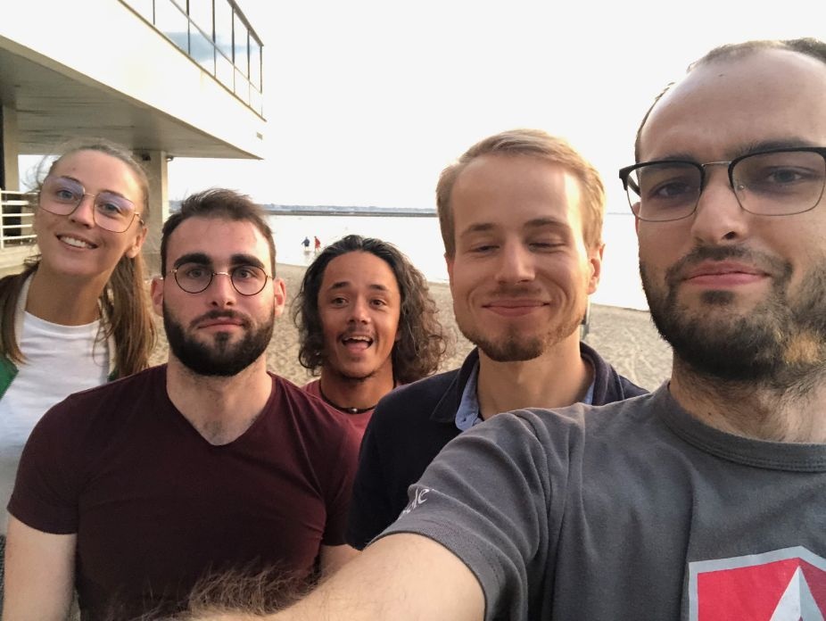 Five Crisp colleagues posing together outdoors