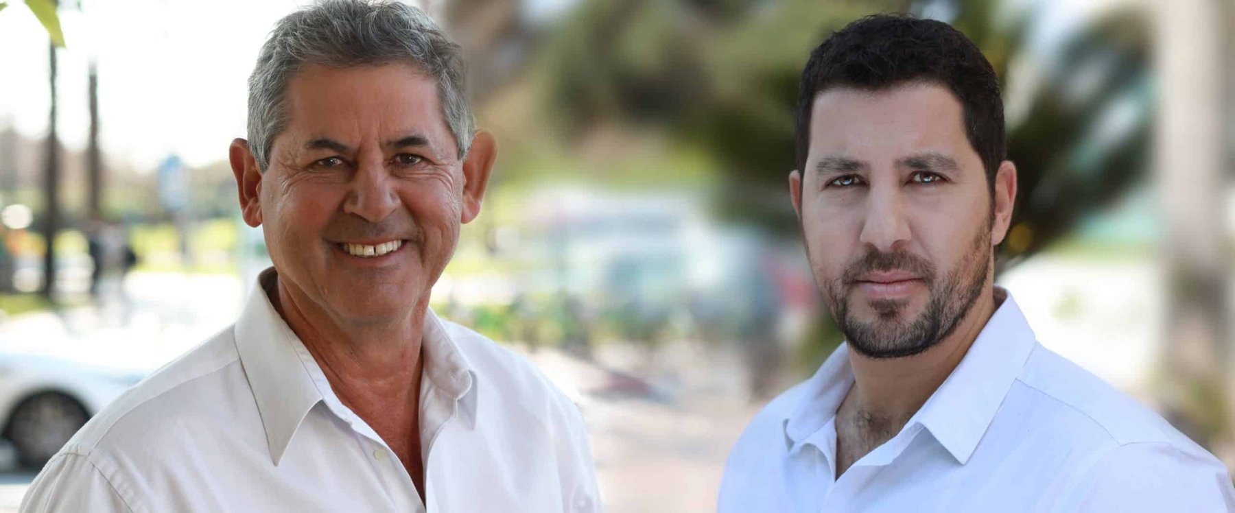 Barry Shaked, left, smiling beside Tabit co-founder Nadav Solomon outdoors