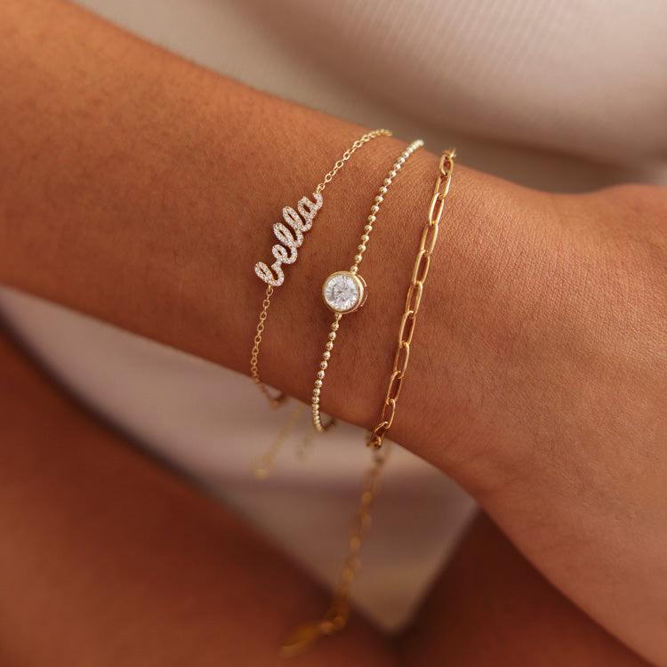 Personalized BaubleBar jewelry shown in the company’s custom collection photography
