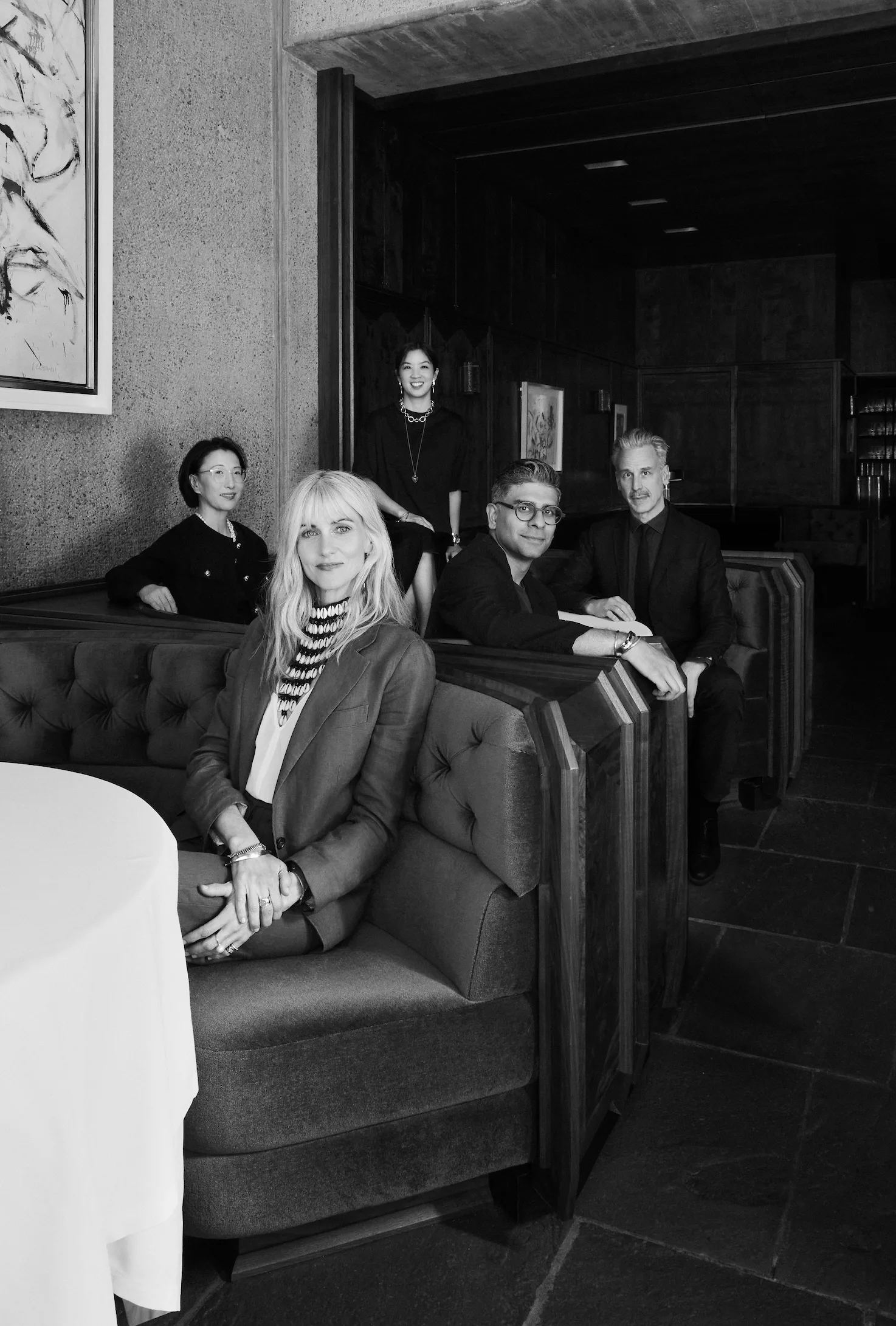 Members of the Becca team seated together in a restaurant