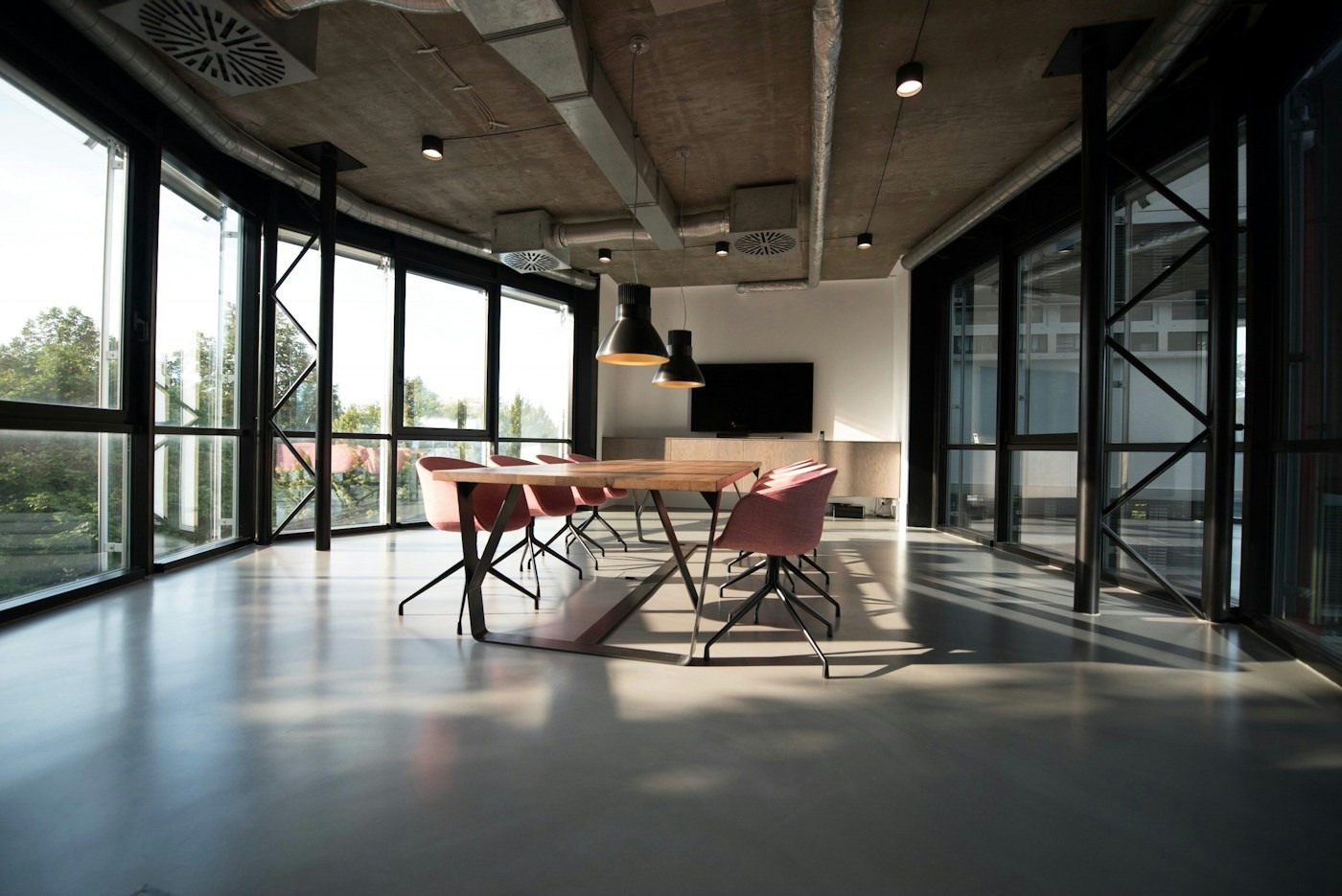 Sunlit office with shared tables and chairs