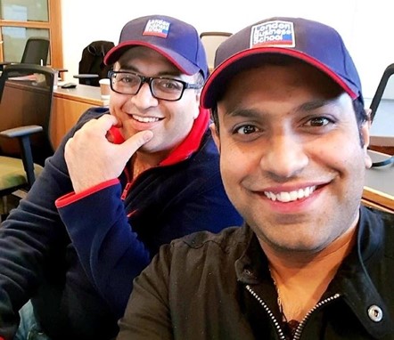 Manish Chachada on the left and Beenu Arora on the right, wearing London Business School caps