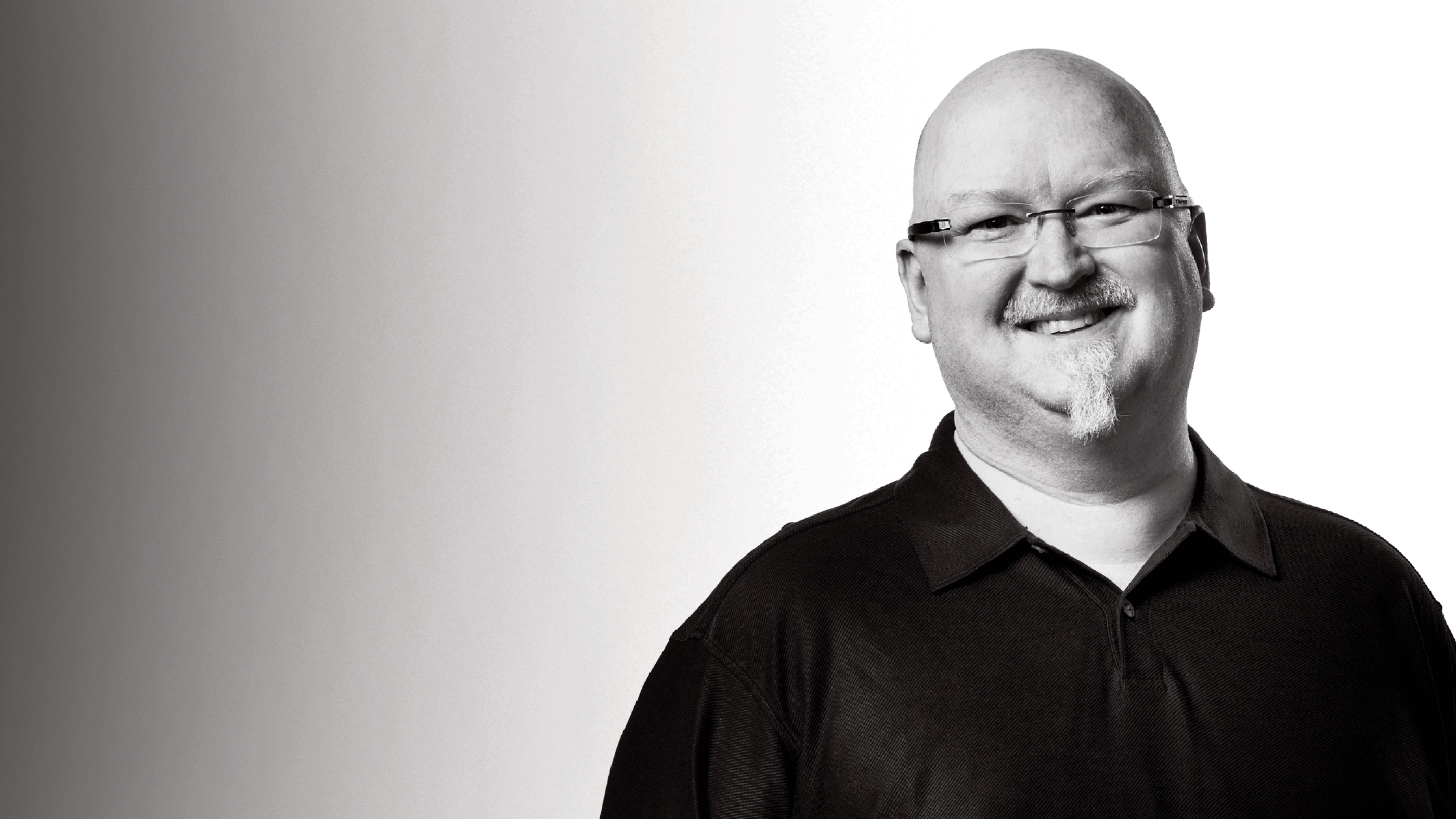 Black-and-white portrait of Behind the Tech host Kevin Scott