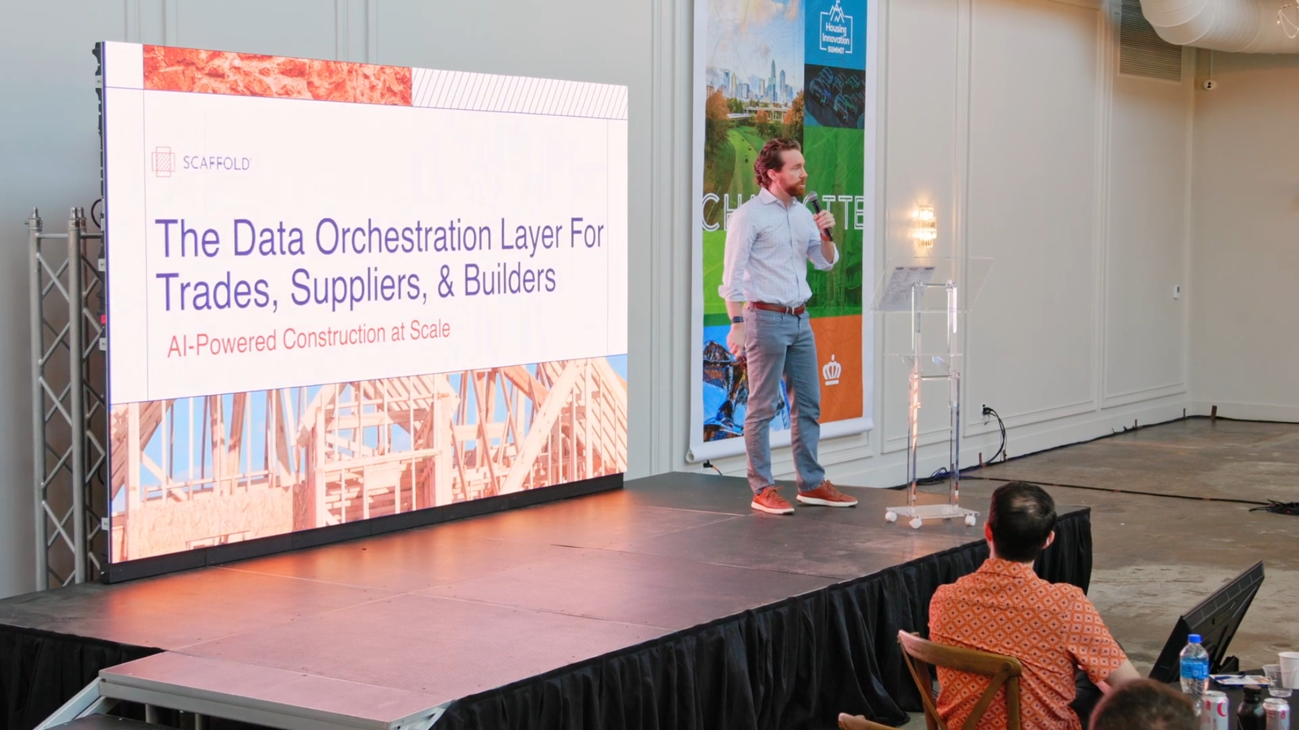 Ben Johnson presenting Scaffold onstage at the 2026 Housing Innovation Summit