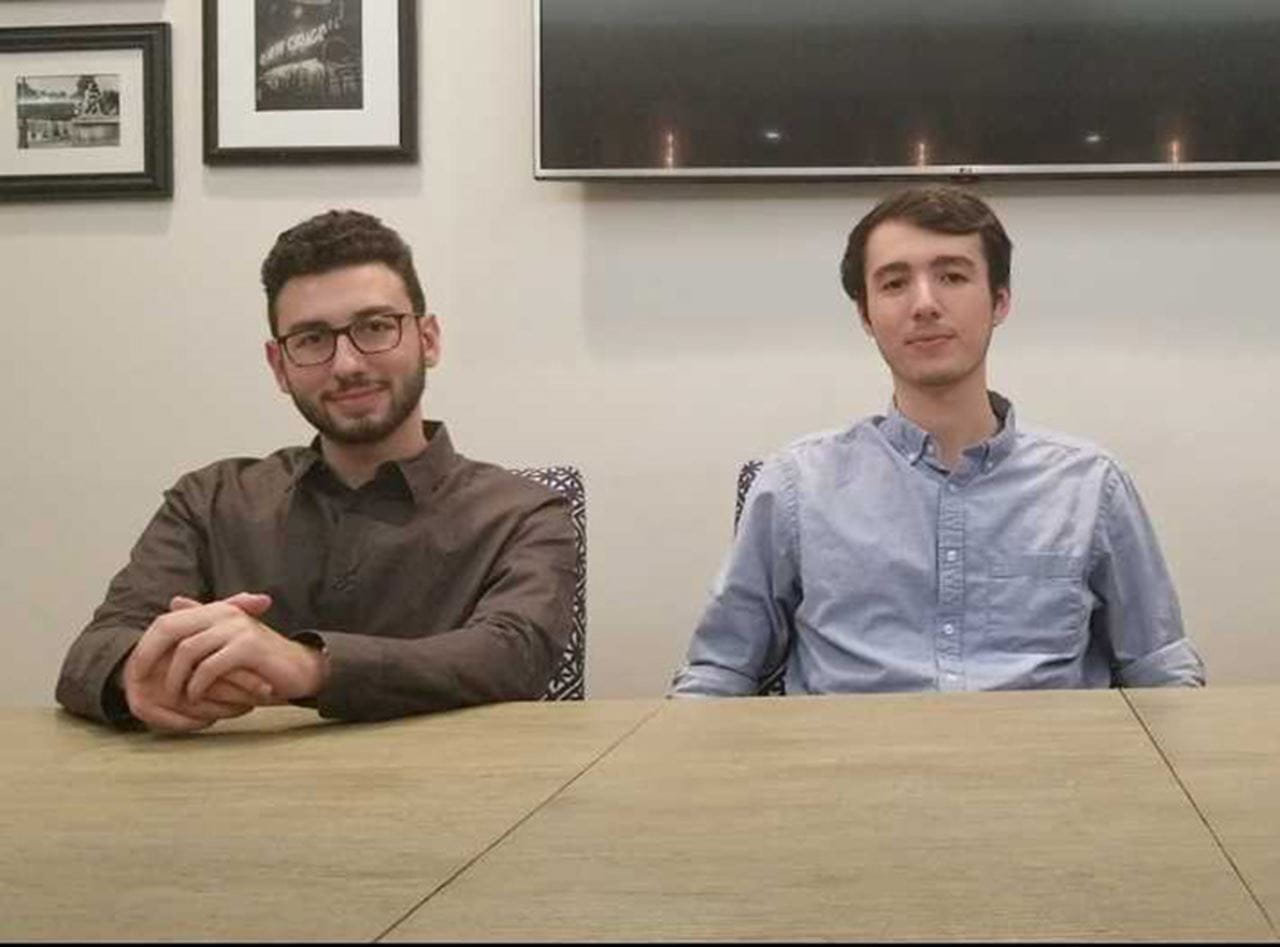 Ben Kestenbaum, left, and Michael Grant Warshowsky seated at a table