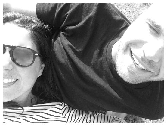 Belynda and Ben Macpherson smiling together in a black-and-white photograph