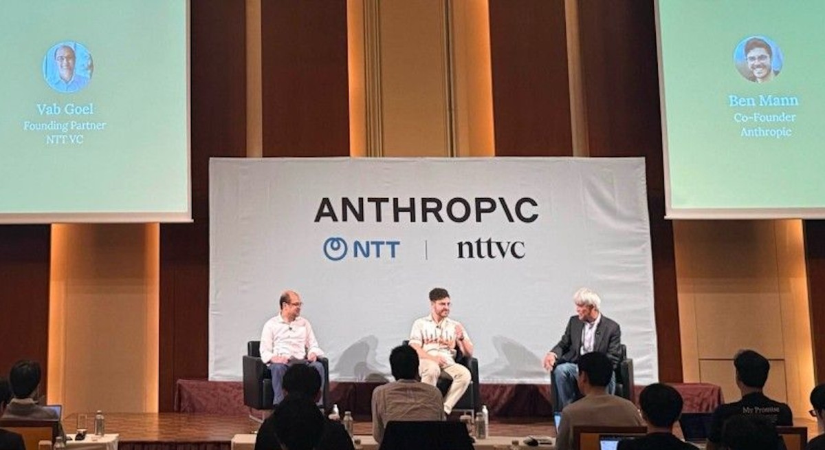 Ben Mann, seated at center with a microphone, speaking at an Anthropic discussion in Tokyo